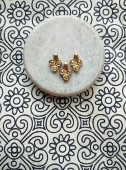 Small brass charms crafted for jewelry making