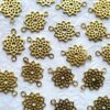 Geometric flower brass connector charm with open petals